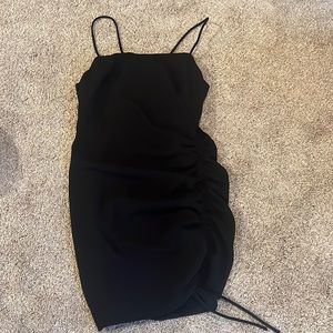 Black speggetti strap dress.